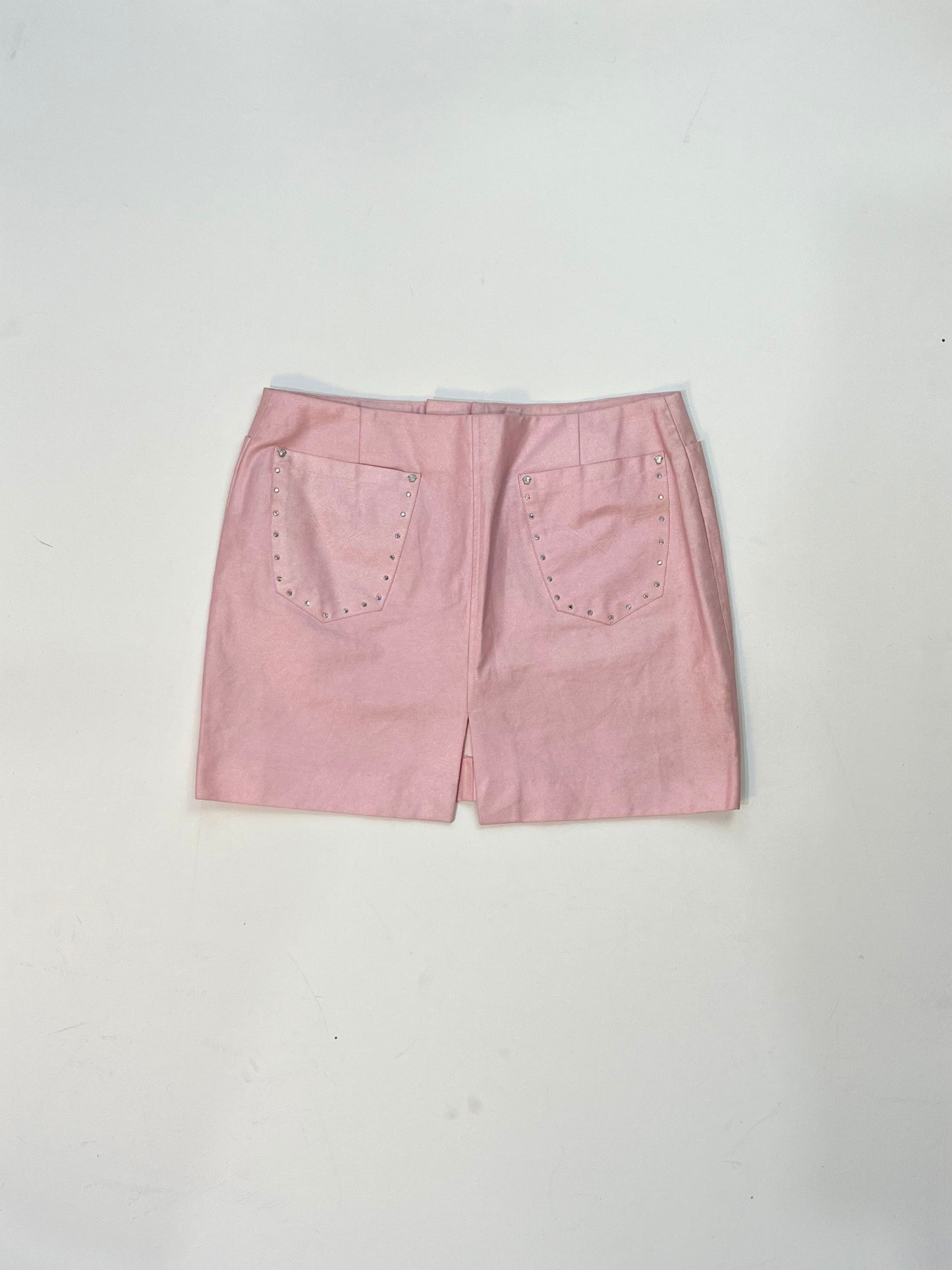 Back view of vintage Versace pink mini skirt with rhinestone studded patch pockets.