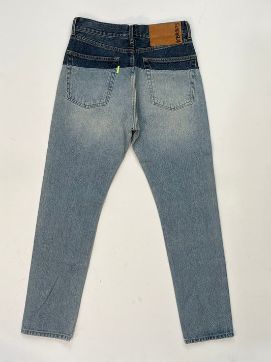 back of Vetements SS19 Sliced Cut-Up Jeans in two-tone blue denim with dark indigo waistband spliced onto light wash denim body.