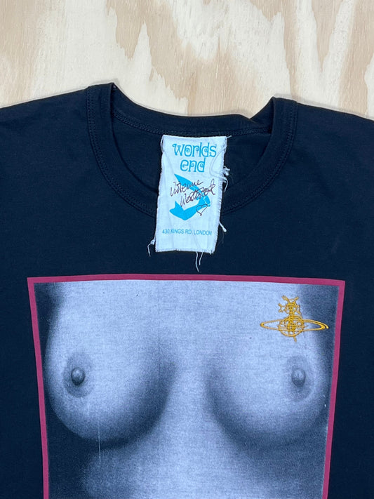 Close up of Vintage Vivienne Westwood Worlds End “Tits” T-shirt in black cotton featuring iconic monochrome chest print framed in red with gold Orb logo, rare 1990s archival piece from Westwood’s first store Worlds End.