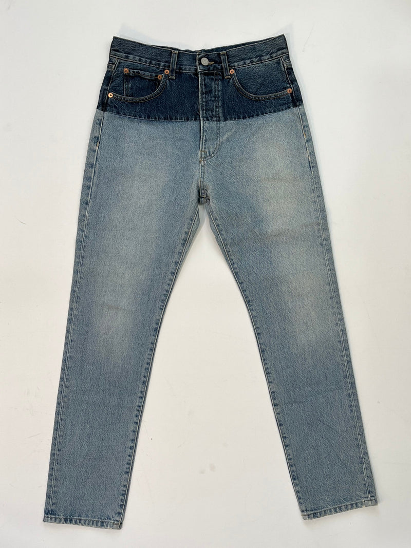 Vetements SS19 Sliced Cut-Up Jeans in two-tone blue denim with dark indigo waistband spliced onto light wash denim body.