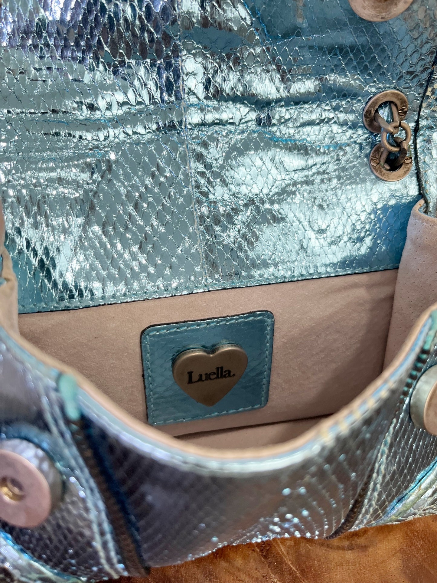 Vintage Luella metallic turquoise snakeskin handbag with silver buckle, chain strap, and signature heart charms, early 2000s Y2K It-bag.