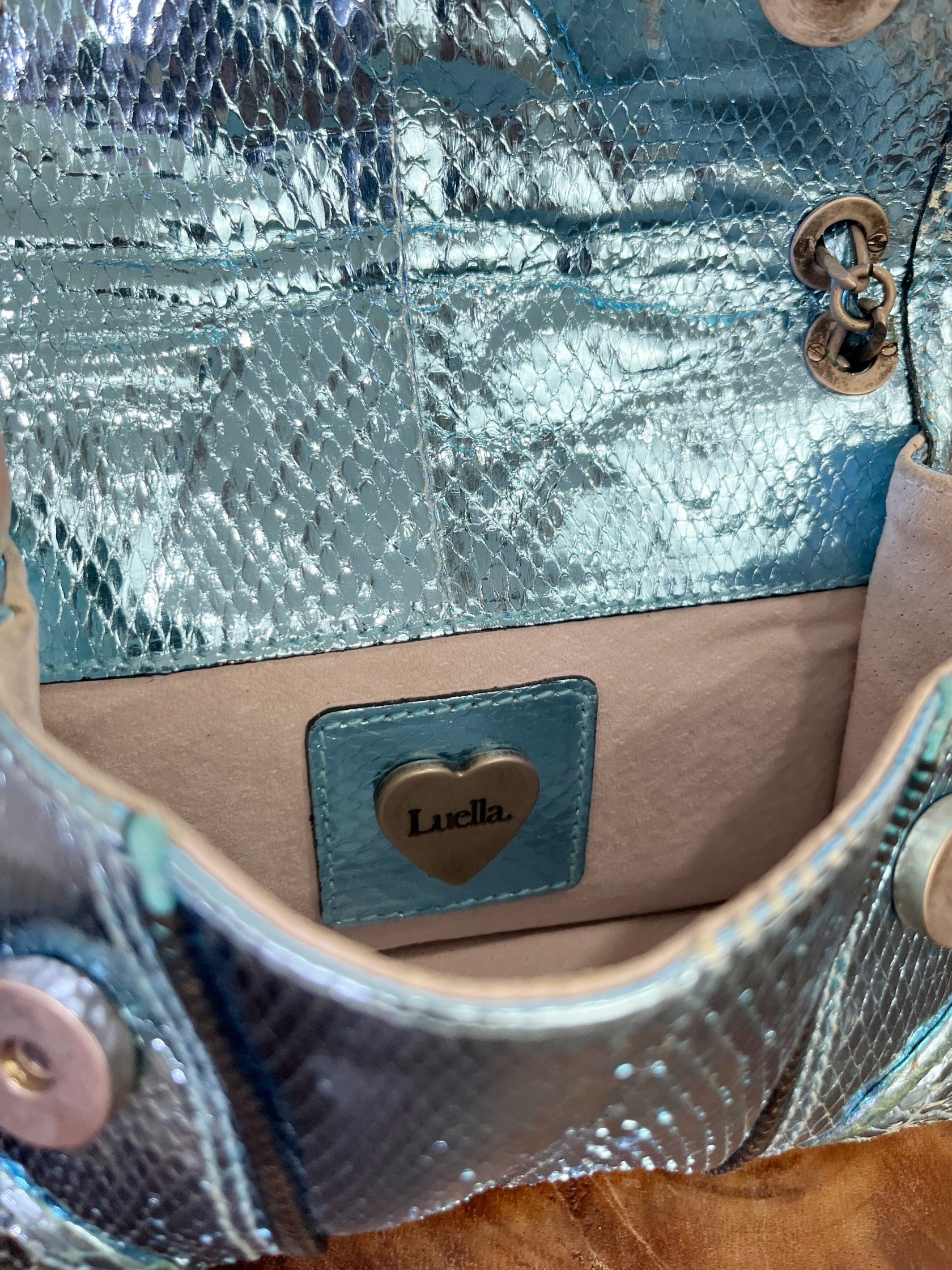 Vintage Luella metallic turquoise snakeskin handbag with silver buckle, chain strap, and signature heart charms, early 2000s Y2K It-bag.