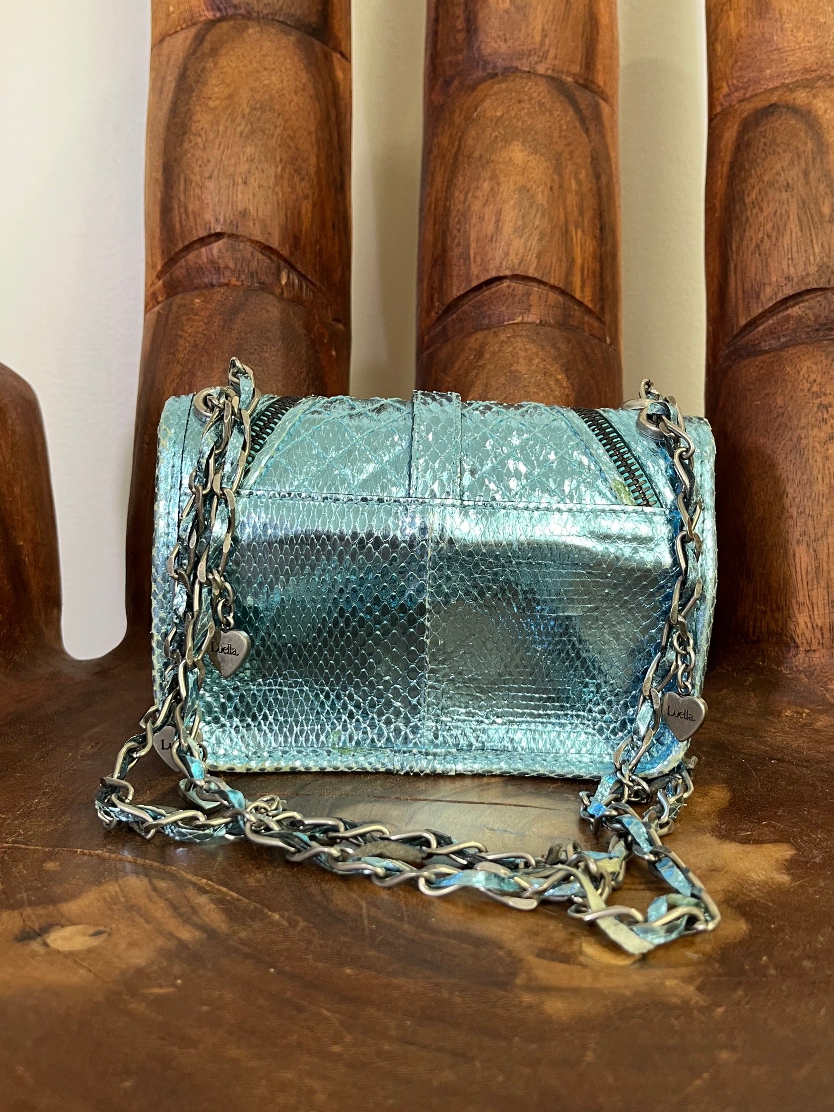Vintage Luella metallic turquoise snakeskin handbag with silver buckle, chain strap, and signature heart charms, early 2000s Y2K It-bag.