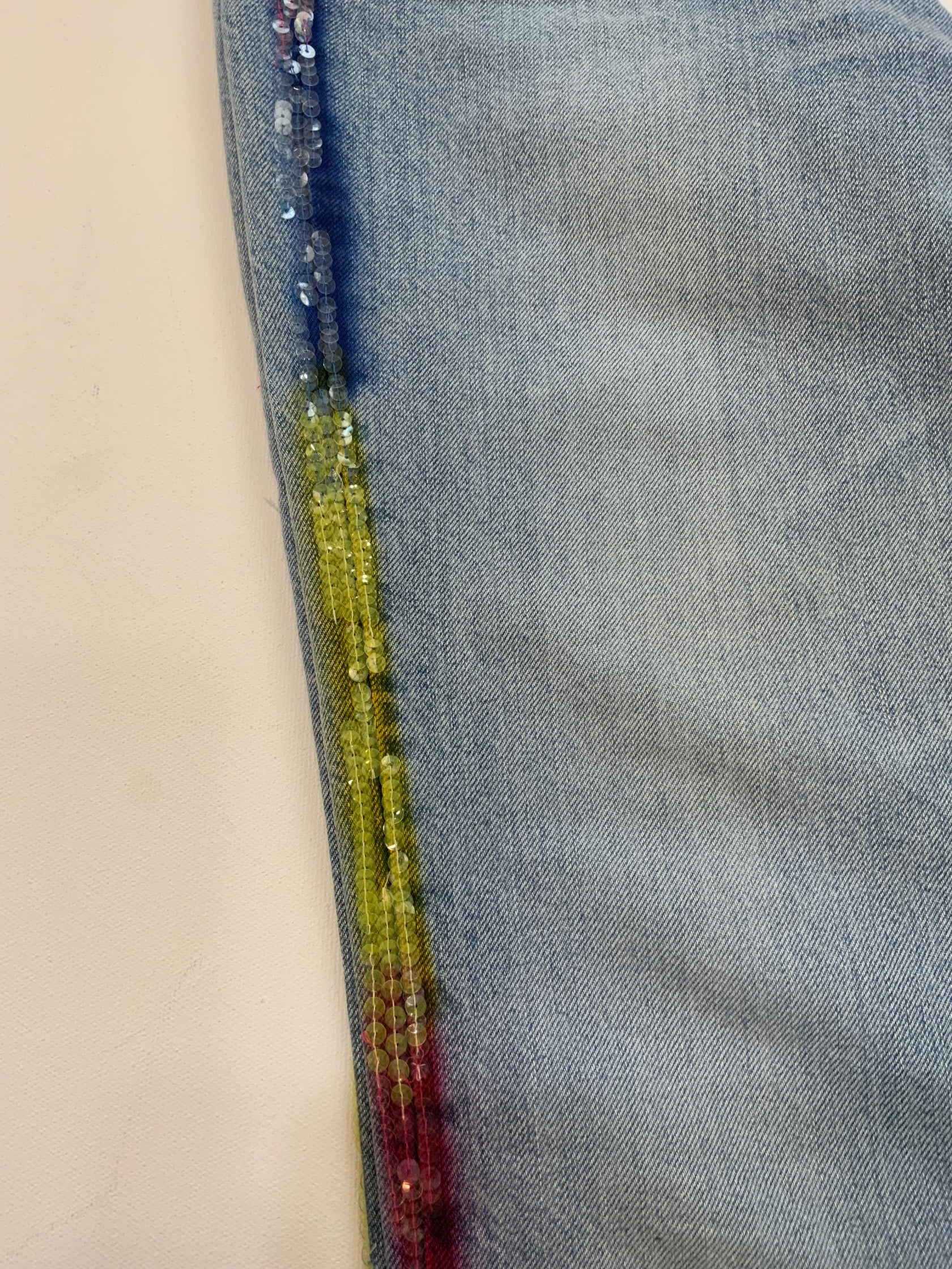Vintage Iceberg denim jeans in light blue wash with rainbow sequin side stripes and Ice Jeans Iceberg back patch.