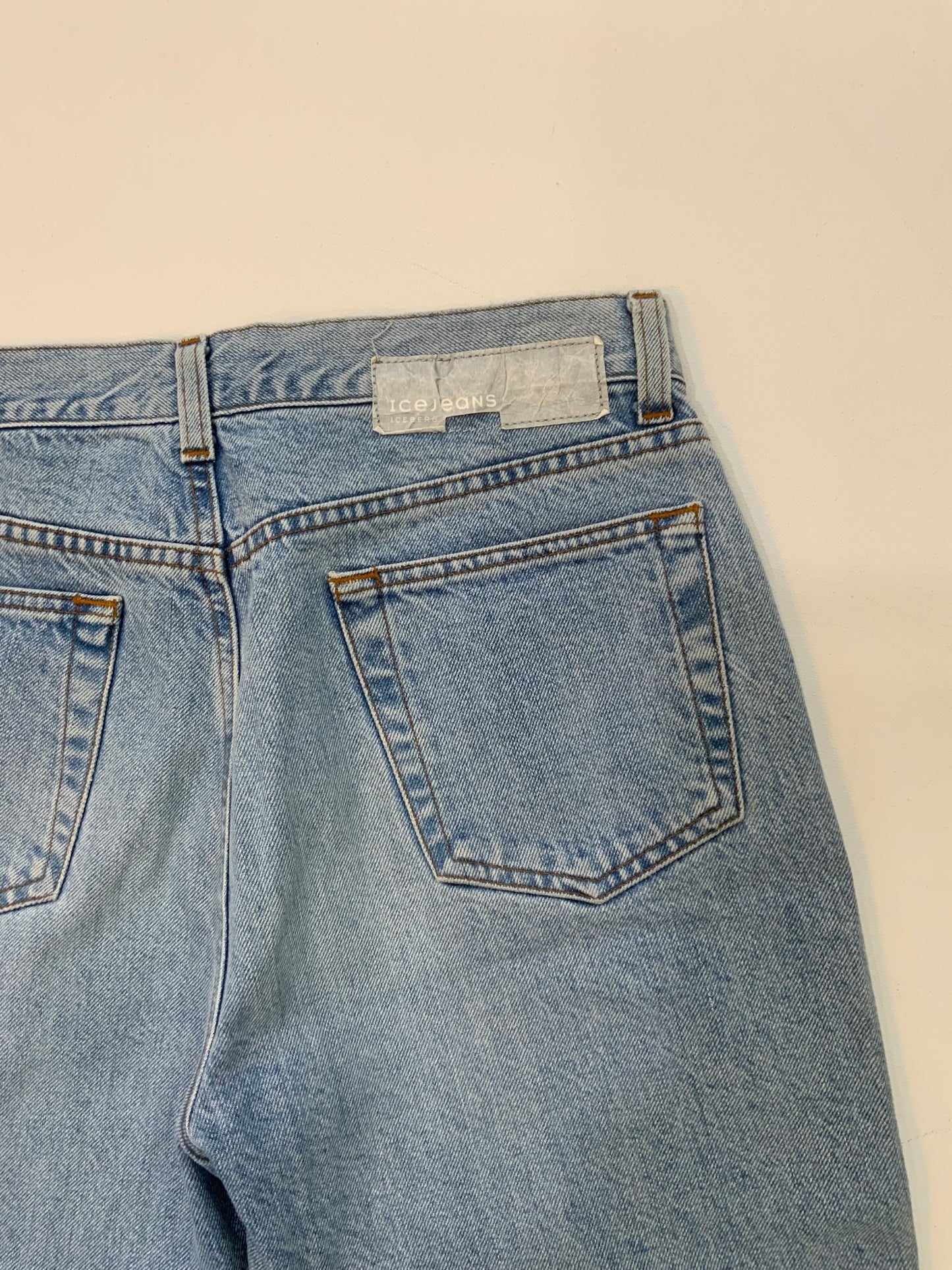 Vintage Iceberg denim jeans in light blue wash with rainbow sequin side stripes and Ice Jeans Iceberg back patch.