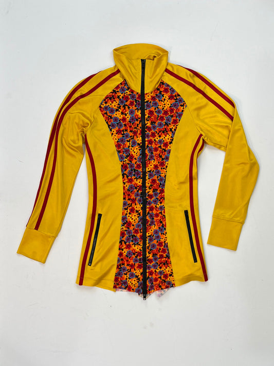 Marni yellow zip-up track jacket with multicolor floral panel, red sleeve stripes, high collar, and zippered pockets.