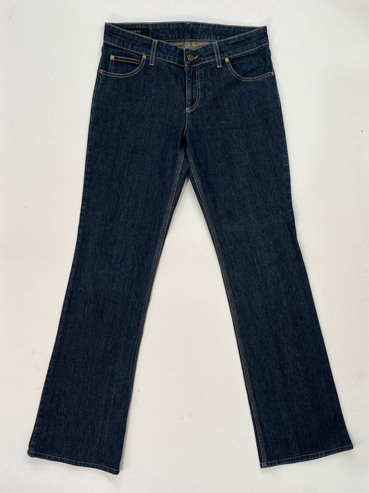 Gucci dark blue denim jeans in straight-leg cut with leather Gucci logo patch at back waistband, Italian size 44.