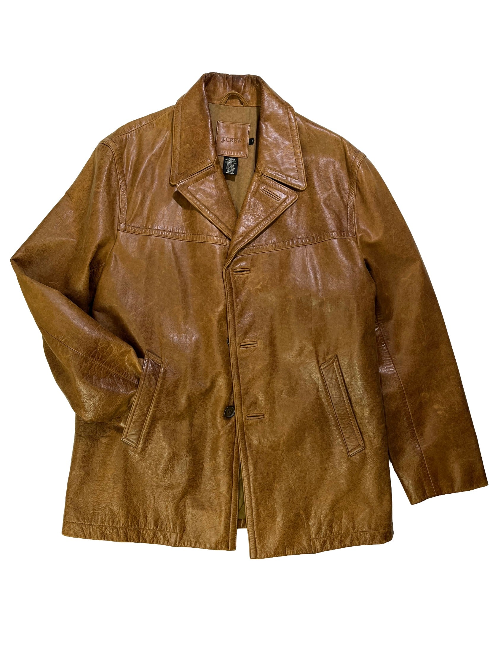 Vintage 1990s J.Crew brown cowhide leather jacket with natural patina, wide lapel collar, and button-front closure.