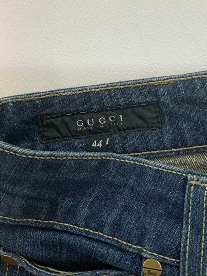 Gucci dark blue denim jeans in straight-leg cut with leather Gucci logo patch at back waistband, Italian size 44.