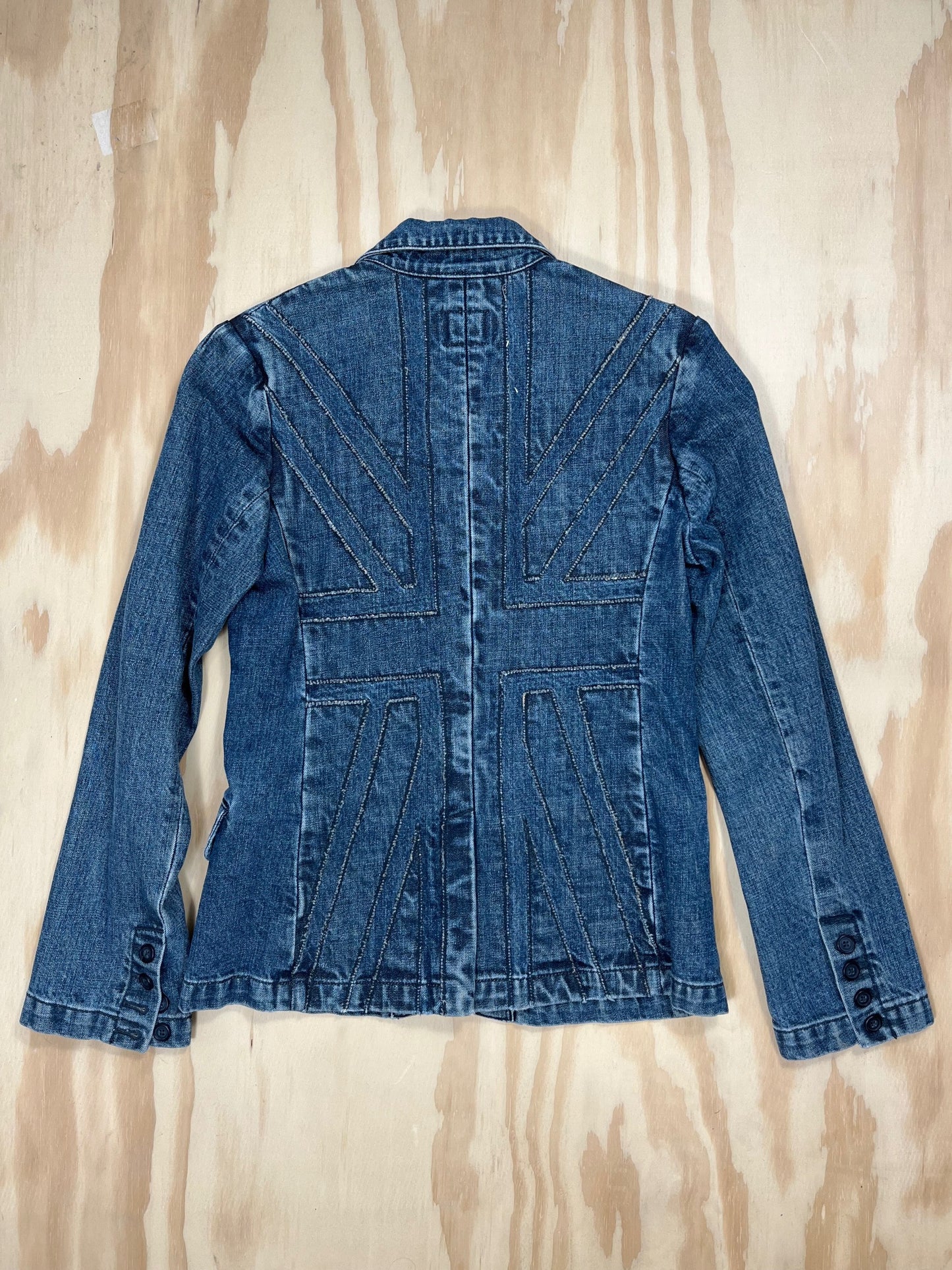 Vintage denim blazer with bold Union Jack stitched panel across the back, Britpop-inspired Y2K style.