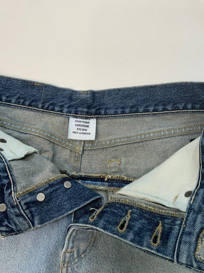 Vetements SS19 Sliced Cut-Up Jeans in two-tone blue denim with dark indigo waistband spliced onto light wash denim body.