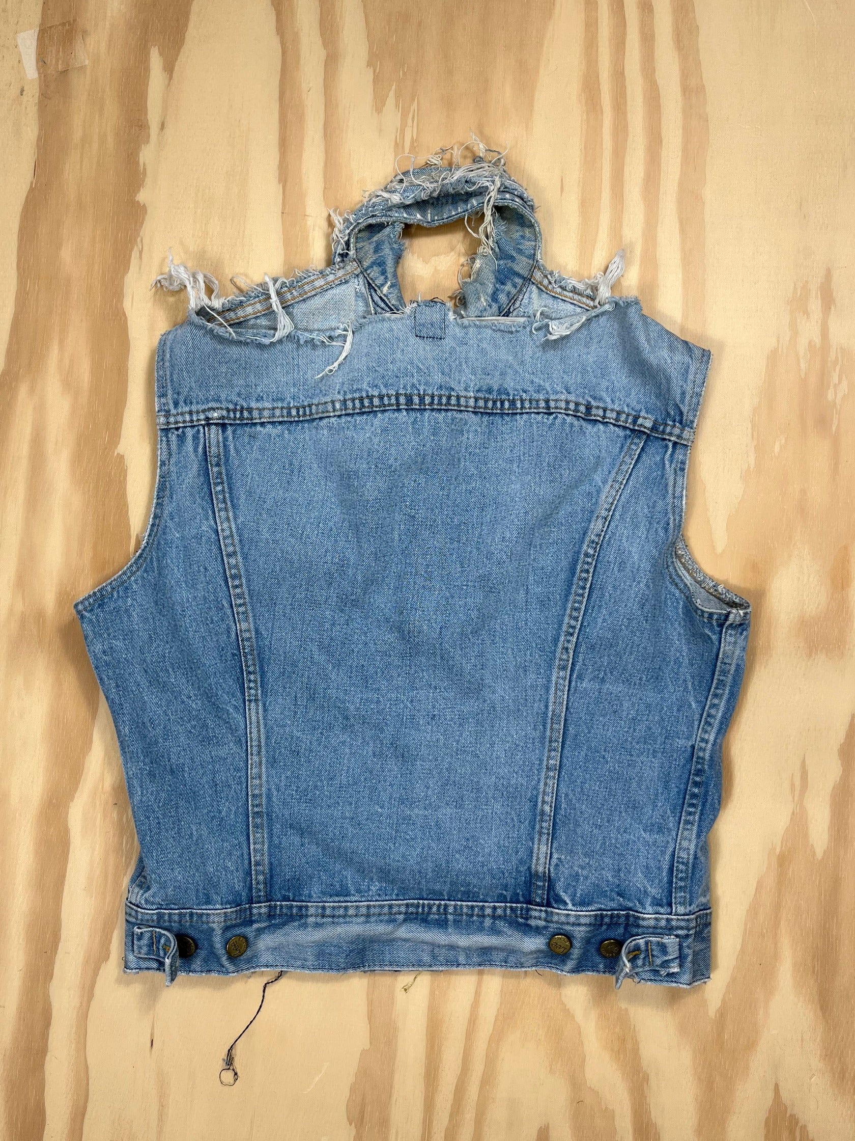 Back view of Lee denim vest with light wash and raw detailing.