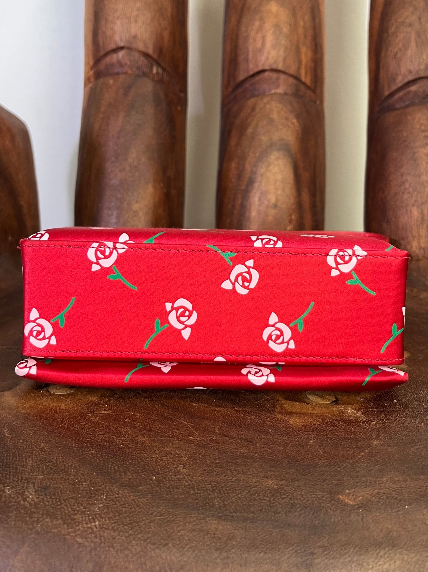 Shushu/Tong red satin mini bag with white rose print, structured silhouette, and red leather strap from the 2022 collection.