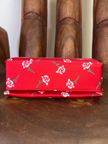 Shushu/Tong red satin mini bag with white rose print, structured silhouette, and red leather strap from the 2022 collection.