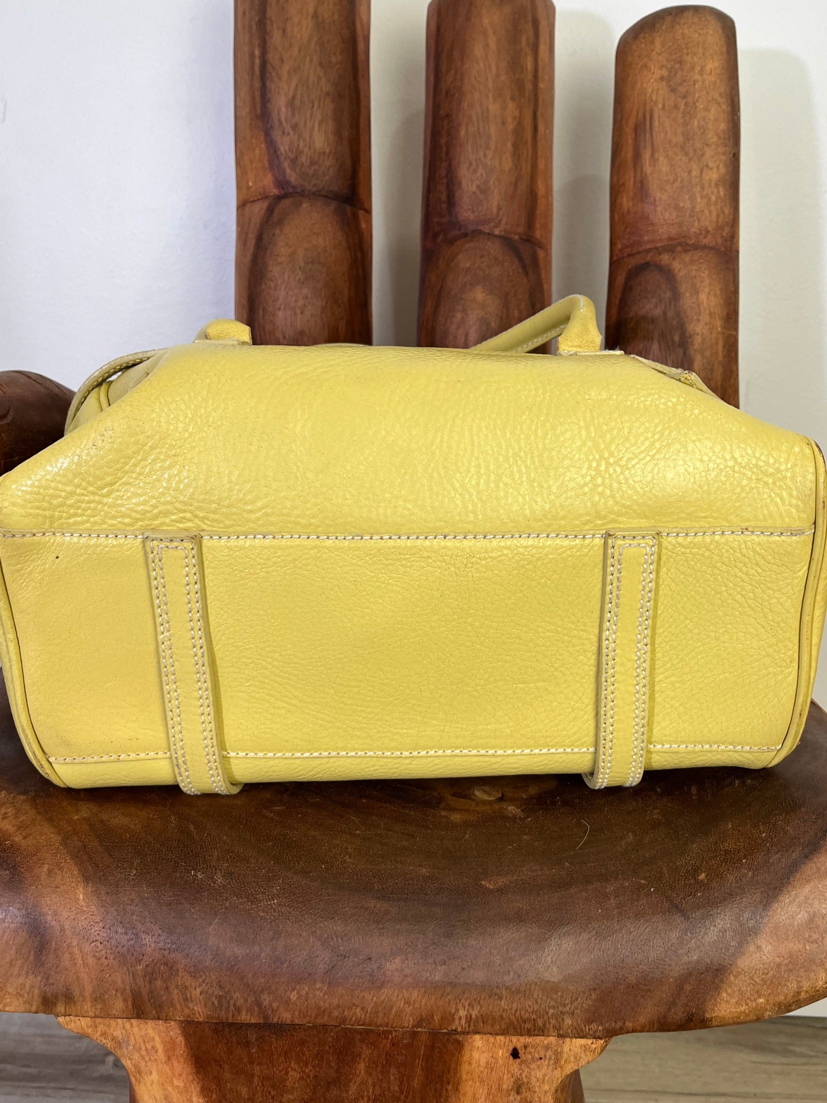Vintage Luella Gisele bag in yellow grained leather with silver hardware, buckle details, and signature heart charm, iconic early 2000s It-bag.